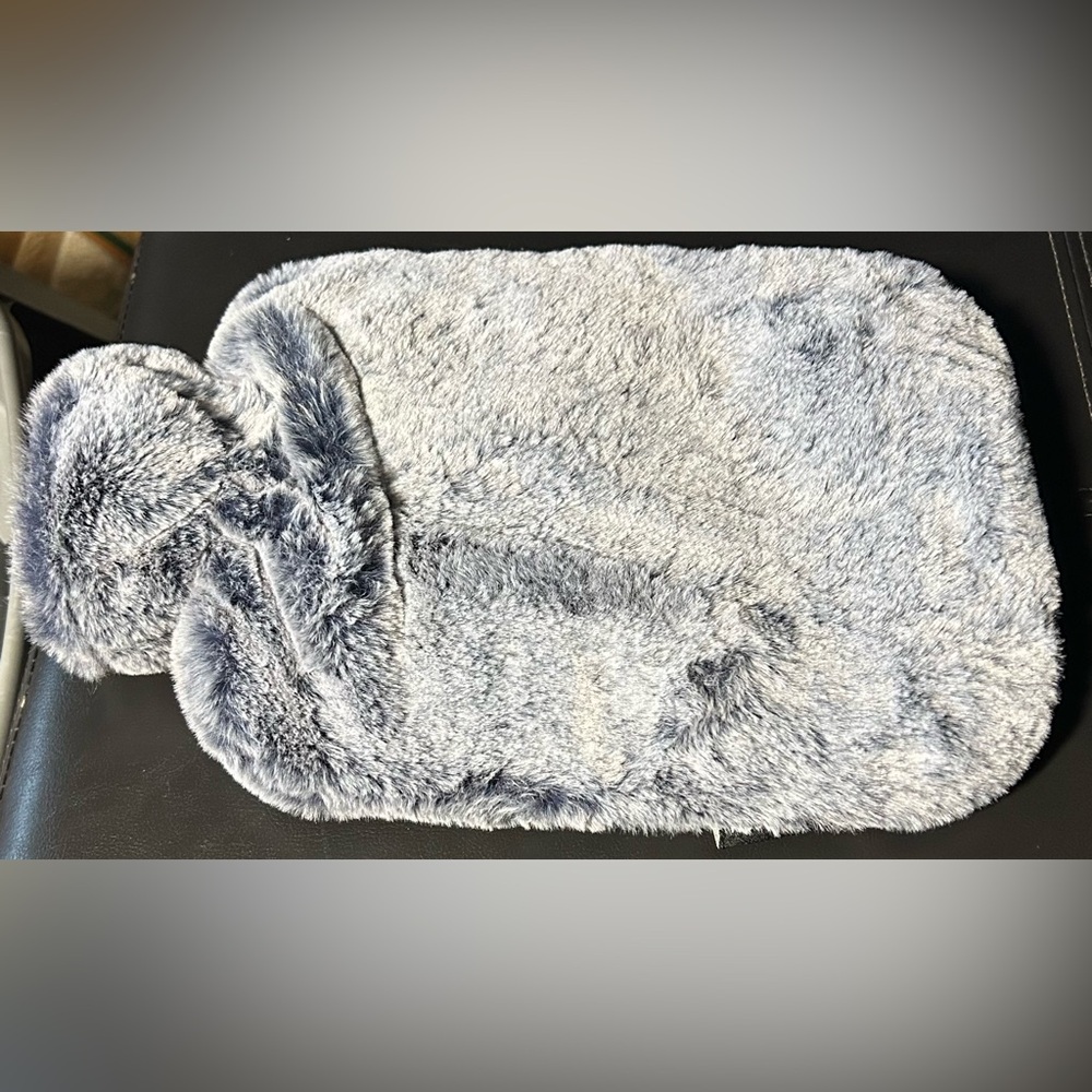 Hot water bottle with a removable faux fur cover
